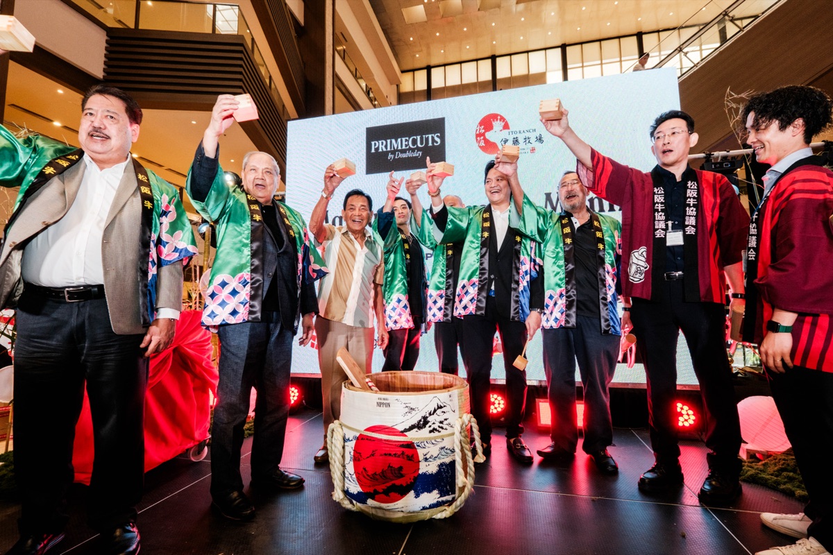Executives raise a toast with sake at the Matsusaka Beef launch